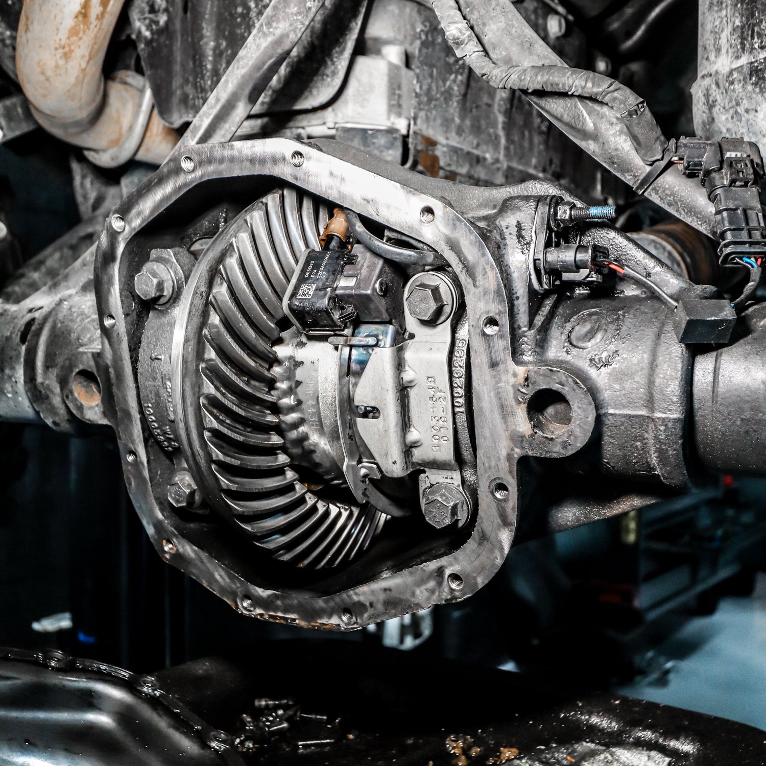 Close-up of a mechanical gear system in a vehicle engine.